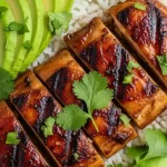 Grilled Qdoba Adobo Chicken served with fresh lime and cilantro