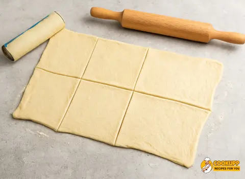 Pizza dough rolled and cut into squares for homemade hot pockets